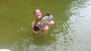 Couple wading in pond